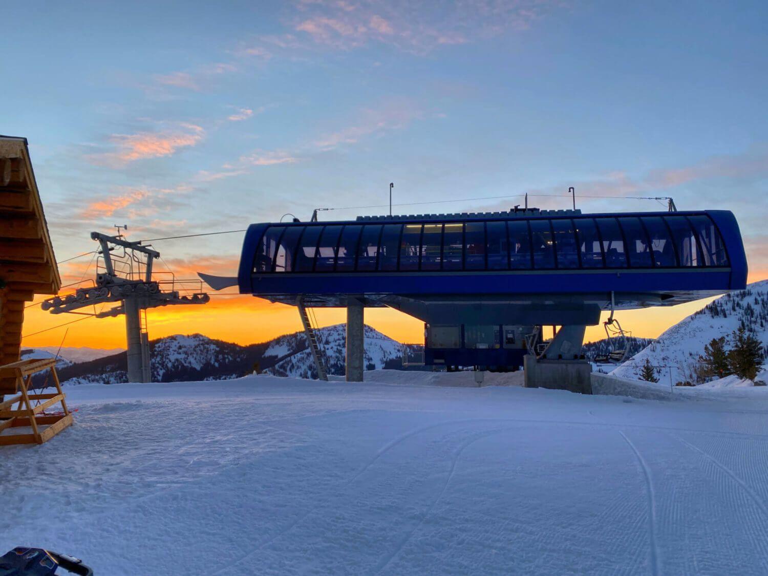 A ski chair lift at sunrise